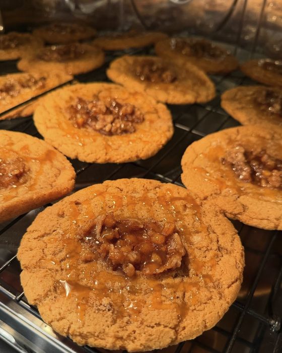 Caramel topped sourdough cookies cooling on a wire rack