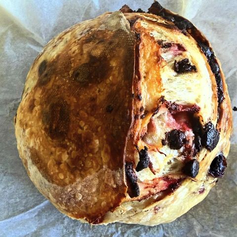 Cherry chocolate sourdough loaf with a crackled crust