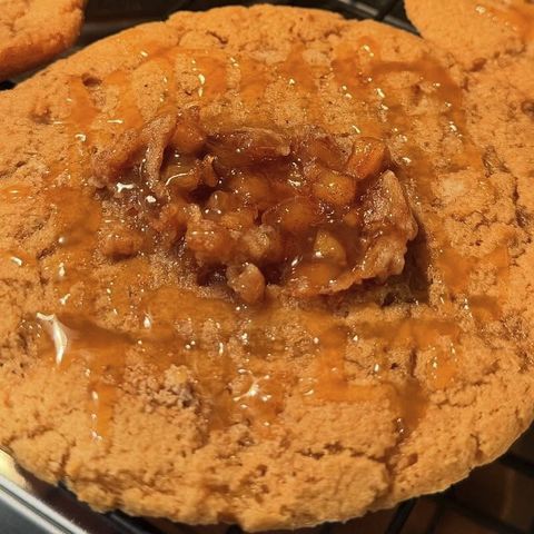 Caramel pecan cookie on a cooling rack
