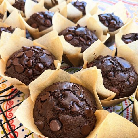 Double chocolate chip muffins in parchment wrappers