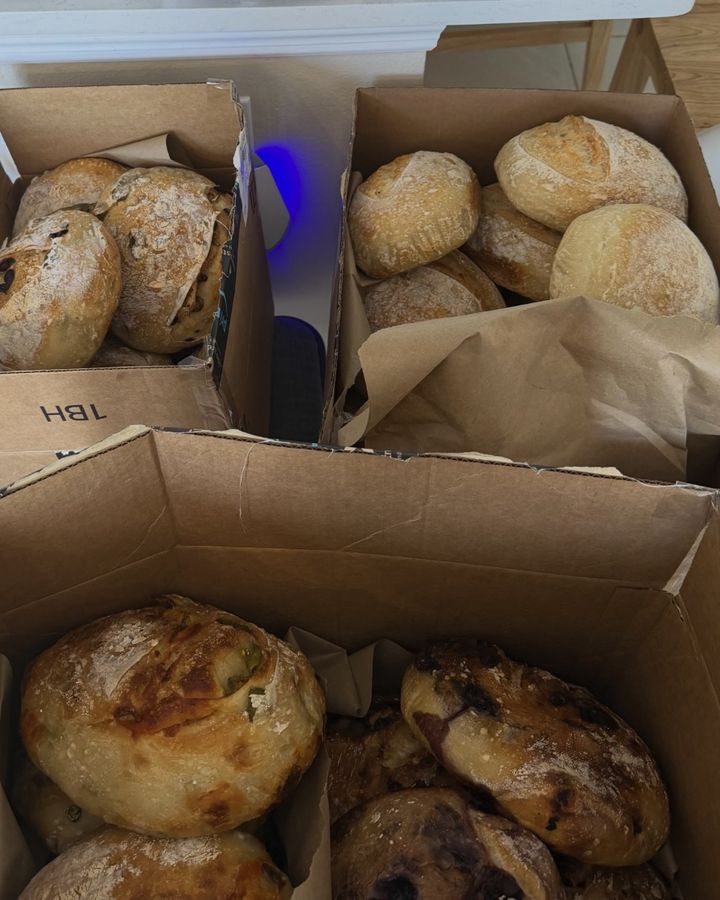 Boxes of sourdough boules and loaves packed and ready to go out